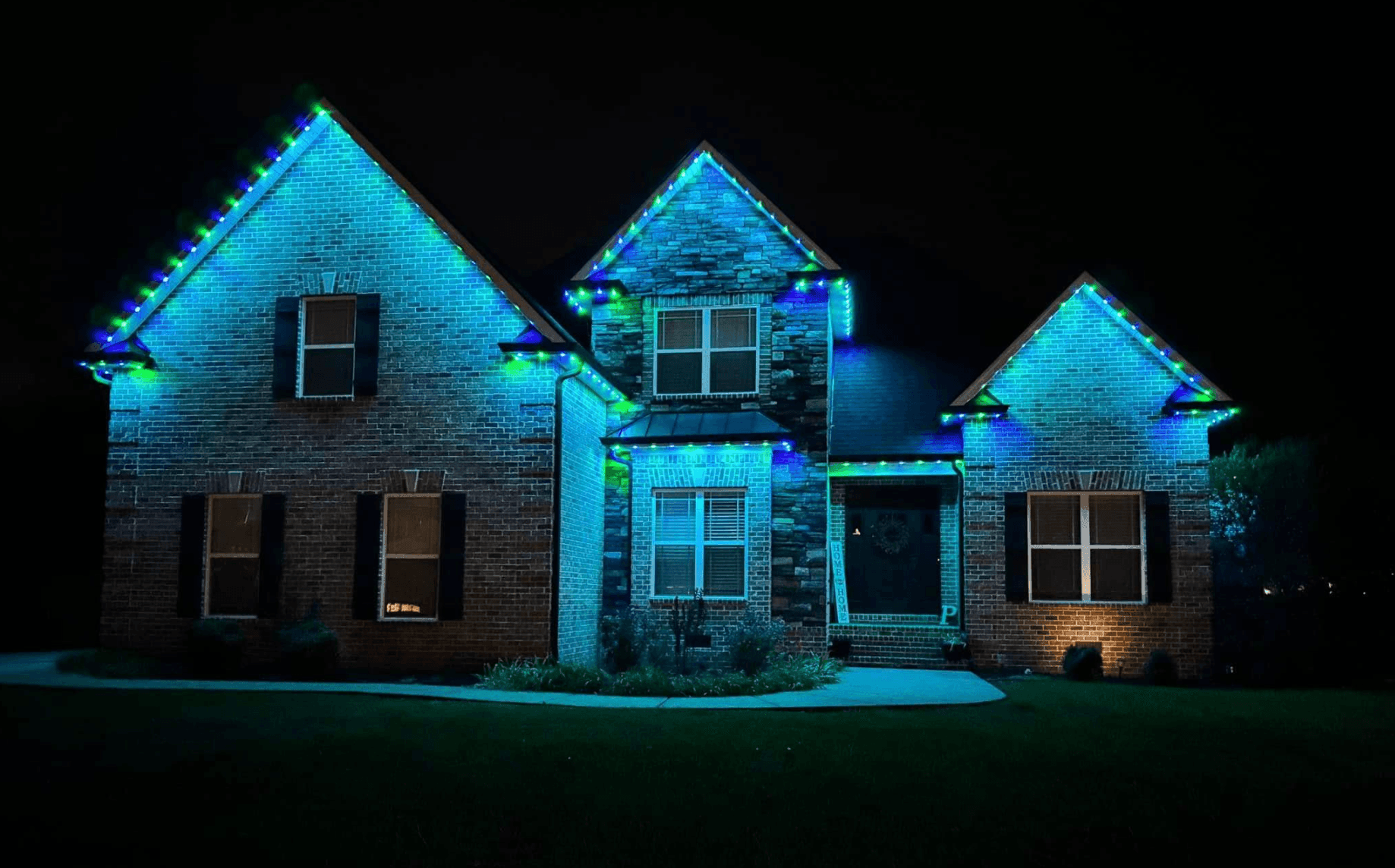 Green and blue minleon permanent lighting on a house